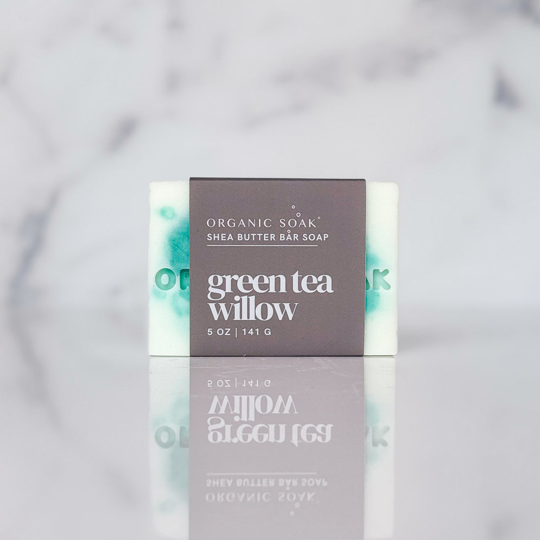 bar of soap - green tea and willow - against a marble background