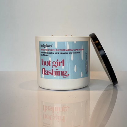 Candle with a label reading &