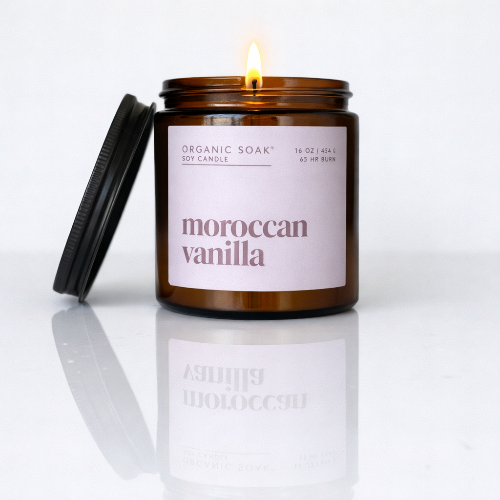 Candle in a brown jar labeled &