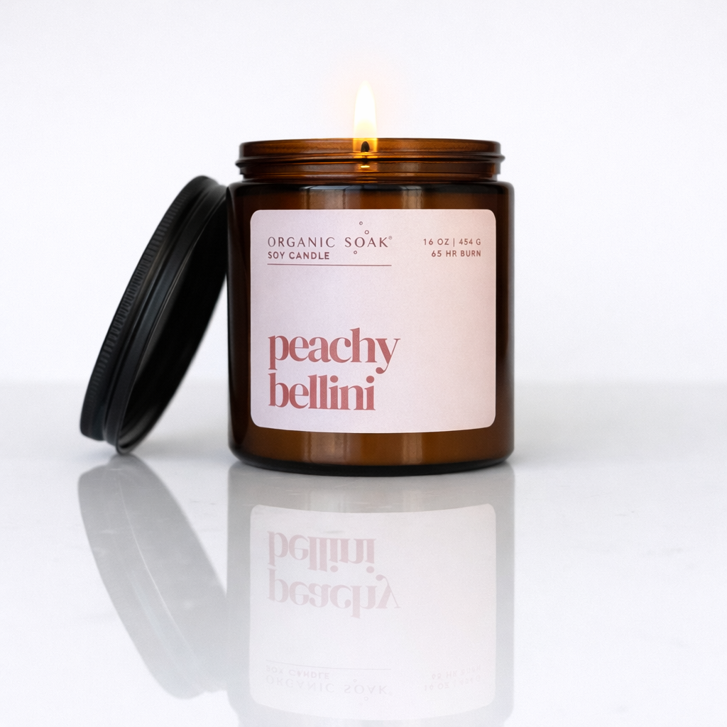 Candle in a glass jar labeled &