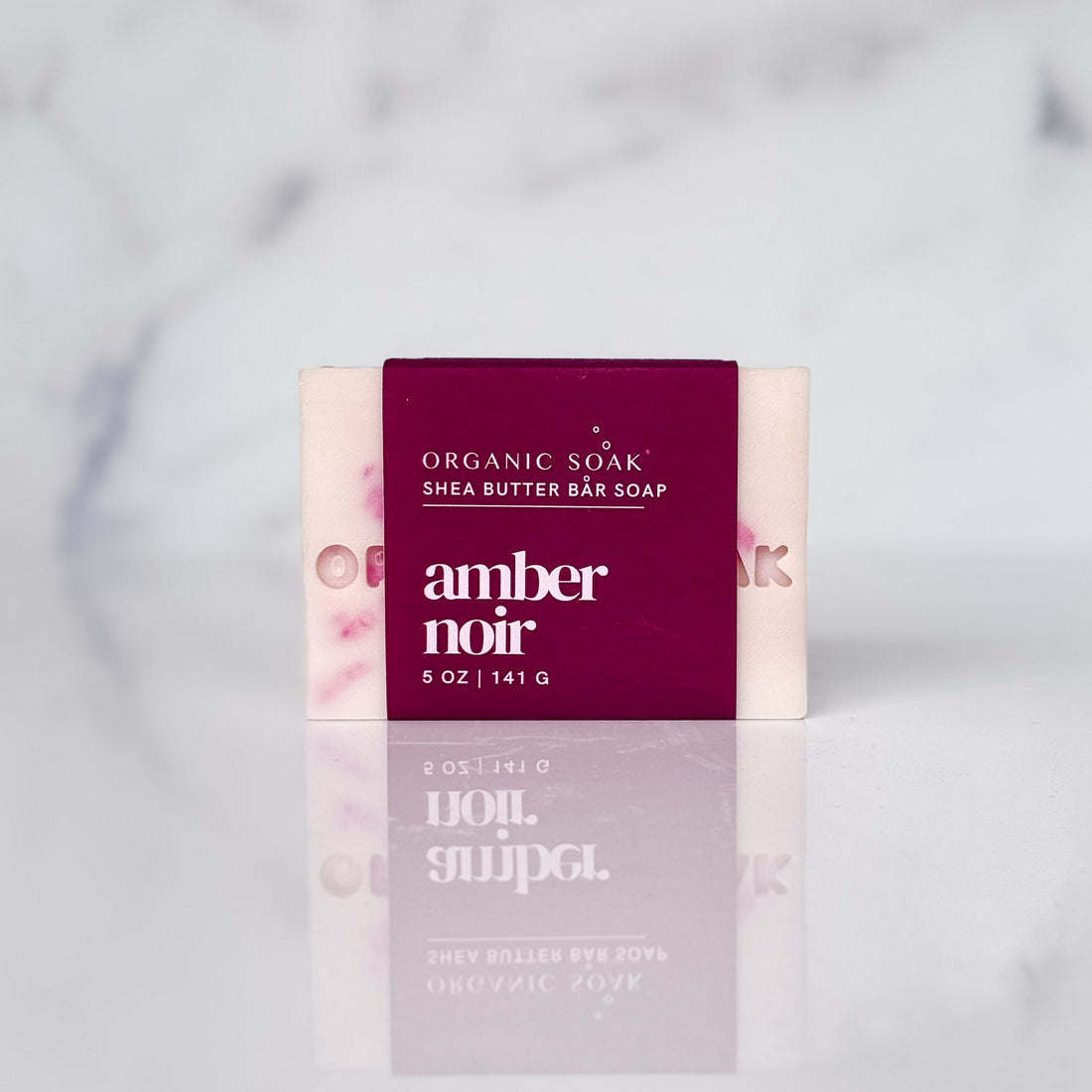 amber noir shea bar soap against a marble background